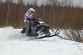 Fast moving snowmobile rider