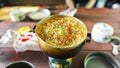 Fast-paced noodles with herbs in an old pot.