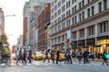 Fast paced street scene with people walking across intersection in New York City Royalty Free Stock Photo