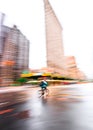 New York City Street Biker Blurred Out with Flatiron Building in the Background