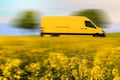 Fast parcel delivery, yellow mail van on country road