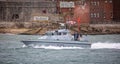 Fast Patrol Ship HMS Sabre heading out to sea in Portsmouth Harbour, Hampshire, UK