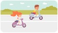 Fast races of two cute children on motorcycles on asphalt road, kids accelerate scooters Royalty Free Stock Photo