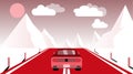 A fast racing sports red car rides a trip to the mountains along the road against the backdrop of pink mountains, sun and clouds.