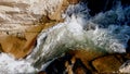 Fast and rapid water stream flowing over sharp rocks and cliffs Royalty Free Stock Photo