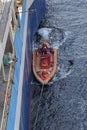 The Fast Rescue Craft of a Seismic Research Vessel being launched from the Port side of the Mother Ship