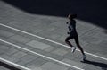 Fast runner. Young african american woman in sportive clothes have workout outdoors at daytime