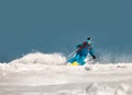 Fast skier downhill at ski resort