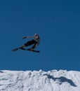 Fast skier flying through the air