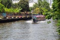 Fast speed express boat on Khlong Saen Seap river in downtown Bangkok