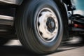 Fast Spinning Truck Wheels. Truck Speed Driving on the Road. Freight Truck Transportation