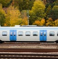 Fast train against Autumn forest Royalty Free Stock Photo