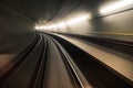 Fast underground train riding in a tunnel of the modern city Royalty Free Stock Photo