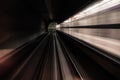 Fast underground train riding in a tunnel of the modern city Royalty Free Stock Photo