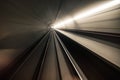 Fast underground train riding in a tunnel of the modern city Royalty Free Stock Photo