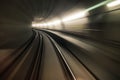 Fast underground train riding in a tunnel of the modern city Royalty Free Stock Photo