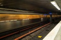 Fast moving underground train at subway metro station.