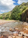 Fast water flow close-up. Nature background with cascades of a mountain stream in close-up. Idyllic landscape with clear water Royalty Free Stock Photo