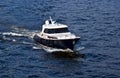 Fast white motor boat on blue water Royalty Free Stock Photo