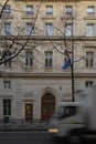 Fast white truck running fast in front the turgot college in Paris