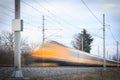 Fast yellow train on the railway motion blurred image Royalty Free Stock Photo