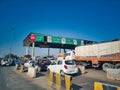 Fastag enabled toll booth plaza and toll gates with traffic lined up in each gate