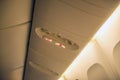 Fasten seat belt sign on a plane and no smoking sign on airplane Royalty Free Stock Photo