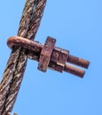 Fastening clamp on the steel cable of the bridge Royalty Free Stock Photo