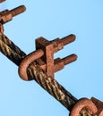 Fastening clamp on the steel cable of the bridge Royalty Free Stock Photo