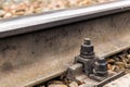 Fastening the rail to the sleeper with a bolt Royalty Free Stock Photo