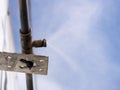 Fastening to the wall of the building with a water mist cooling system nozzle Royalty Free Stock Photo