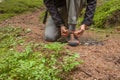Fastening your mountain shoes inside a forest Royalty Free Stock Photo