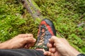 Fastening your mountain shoes inside a forest Royalty Free Stock Photo