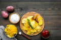 Cooking homemade potato chips with ketchup on wooden background top view Royalty Free Stock Photo