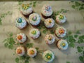 Fastive Easter cakes standing on a mottled surface.