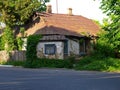 Old clay wooden residential house. Ancient architecture of modern Ukrainian