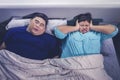 Fat Asian man snoring while sleeping with his wife Royalty Free Stock Photo