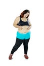 Fat Asian woman pinching her belly Royalty Free Stock Photo