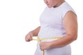 Fat Asian woman wear white t-shirt and checking her body size wi Royalty Free Stock Photo