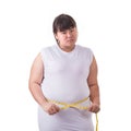 Fat Asian woman wear white t-shirt and checking her body size wi Royalty Free Stock Photo