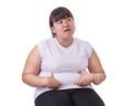 Fat Asian woman wear white t-shirt worried about her body size Royalty Free Stock Photo