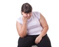 Fat Asian woman wear white t-shirt worried about her body size Royalty Free Stock Photo