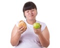 Fat asian woman wearing white t-shirt and choosing to eat fried Royalty Free Stock Photo