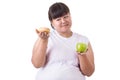 Fat asian woman wearing white t-shirt and choosing to eat green Royalty Free Stock Photo