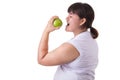 Fat asian woman wearing white t-shirt and eating green apple iso Royalty Free Stock Photo