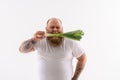 Fat bearded guy eating healthy vegetable Royalty Free Stock Photo