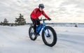 Fat bike. Fat tire bike. A young man riding fat bicycle in the winter