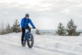 Fat bike. Fat tire bike. A young man riding fat bicycle in the winter Royalty Free Stock Photo