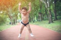 Fat boy enjoy exercise jogging in the park. Chubby children need family attention for weight lose for healthy life Royalty Free Stock Photo