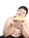 Fat boy is happily eating chip Royalty Free Stock Photo